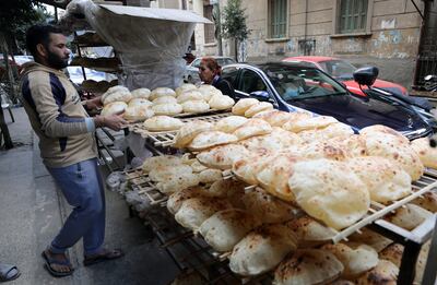 An Egyptian baker arranges bread at a bakery in Cairo, Egypt, in January. EPA