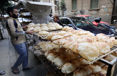 An Egyptian baker arranges bread at a bakery in Cairo last year. EPA