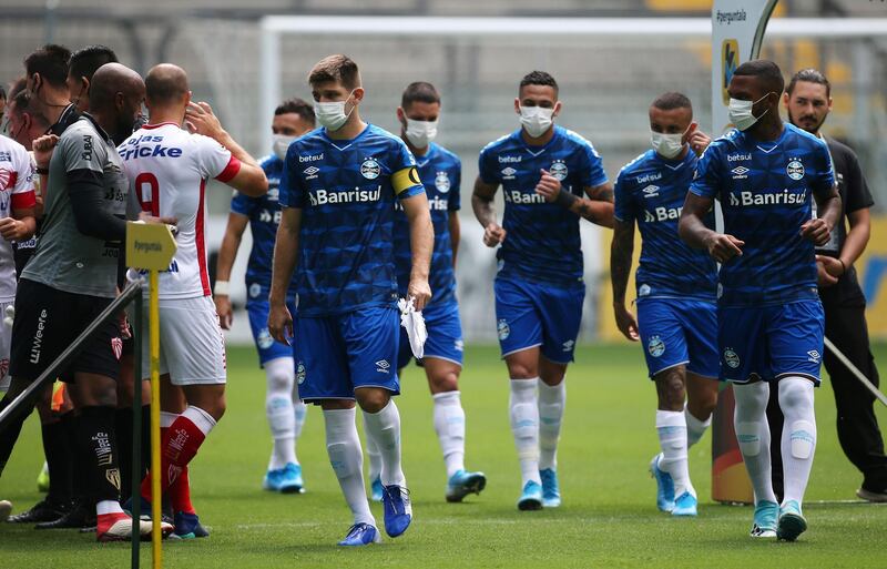 Gremio players wearing masks before the match. Reuters