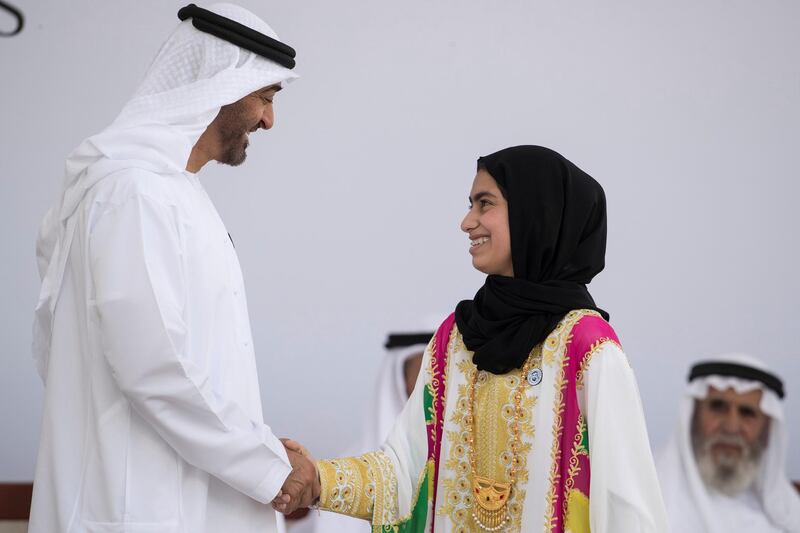 ABU DHABI, UNITED ARAB EMIRATES -  March 12, 2018: HH Sheikh Mohamed bin Zayed Al Nahyan, Crown Prince of Abu Dhabi and Deputy Supreme Commander of the UAE Armed Forces (L), presents an Abu Dhabi Award to Fatima Ali Al Kaabi (R), during the awards ceremony at the Sea Palace.
( Ryan Carter for the Crown Prince Court - Abu Dhabi )
---