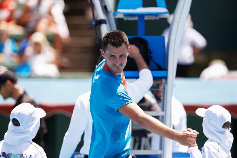 epa07270482 Bernard Tomic of Australia greets ballboys after his match against Nick Kyrgios of Australia during match two of the Kooyong Classic tennis tournament at Kooyong Lawn Tennis Club in Melbourne, Australia, 09 January 2019.  EPA/DANIEL POCKETT AUSTRALIA AND NEW ZEALAND OUT