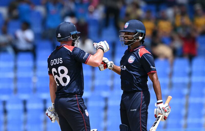 The USA's Andries Gous, left, who made 80 from 47 balls, and Harmeet Singh celebrate a boundary against South Africa. AFP