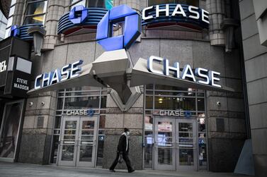 A pedestrian wearing a protective mask walks past a JPMorgan Chase & Co. bank branch in New York, U.S., on Friday, April 10, 2020. JPMorgan Chase is scheduled to release earnings figures on April 14. Photographer: Mark Kauzlarich/Bloomberg