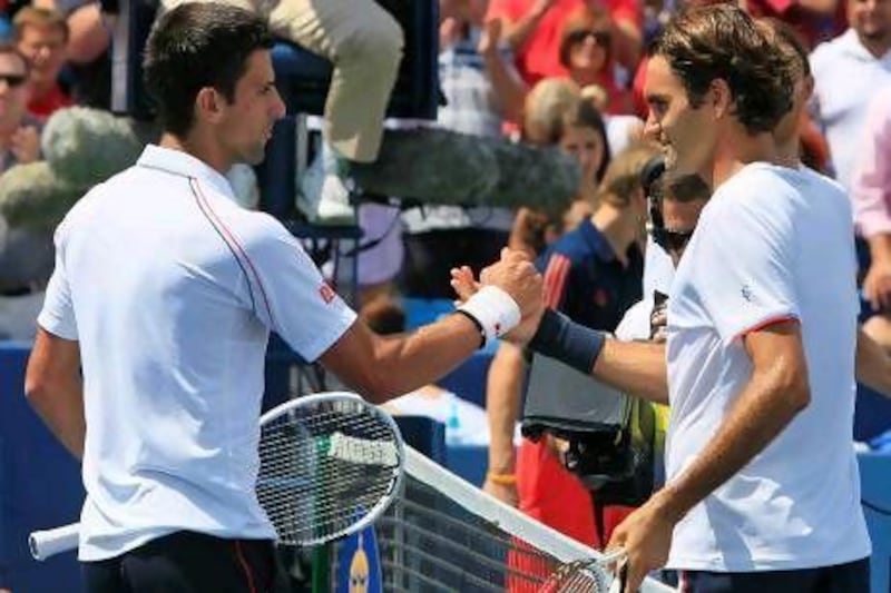 Novak Djokovic, left, and Roger Federer, are part of a trio, with Rafael Nadal, who have dominated men's tennis in recent years.