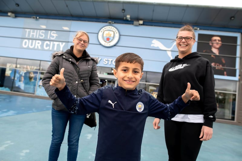 Feature on Manchester City FC at the Etihad complex and Manchester city centre.
PIC shows fans L-R: Zoe Holroyd, Kiyan Iqbal (7) and Natalie Holroyd.