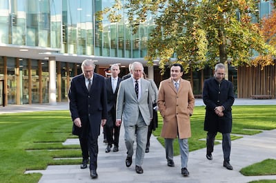 Britain's Prince Charles, centre, is shown around by Mr Johansson, left, at the new Cambridge Biomedical Campus last month. FP