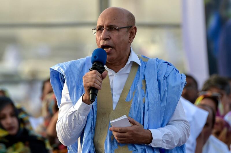 (FILES) In this file photo taken on June 20, 2019 Mauritania's ruling party's candidate, ex-general Mohamed Ould Cheikh Mohamed Ahmed, also known as Ould Ghazouani delivering a speech as he attends his last campaign meeting for the upcoming presidential elections, on June 20, 2019 in Nouakchott. Mauritania's ruling party candidate Mohamed Ould Ghazouani has won the presidential election with 52 percent of the vote, the electoral commission announced on June 23, 2019, with results from all polling stations counted. Ghazouani obtained 52.01 percent of votes cast in June 22,  presidential election, easily beating his main opposition opponents Biram Ould Dah Ould Abeid (18.58 percent) and Sidi Mohamed Ould Boubacar (17.87 percent), according to the official figures.
 / AFP / SIA KAMBOU
