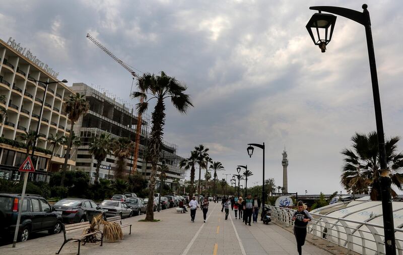 epa06564761 Lebanese families walk during a cloudy day at the Corniche al-Manara in Beirut, Lebanon, 25 February 2018. According to the Lebanese meteorology, the country will be under the effects of a rainstorm on the next 24 hours.  EPA/NABIL MOUNZER