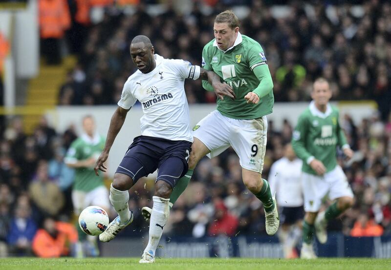 LONDON, ENGLAND - APRIL 09:   Grant Holt of Norwich and Ledley King of Spurs battle for the ball during the Barclays Premier League match between Tottenham Hotspur and Norwich City at White Hart Lane on April 9, 2012 in London, England.  (Photo by Shaun Botterill/Getty Images)