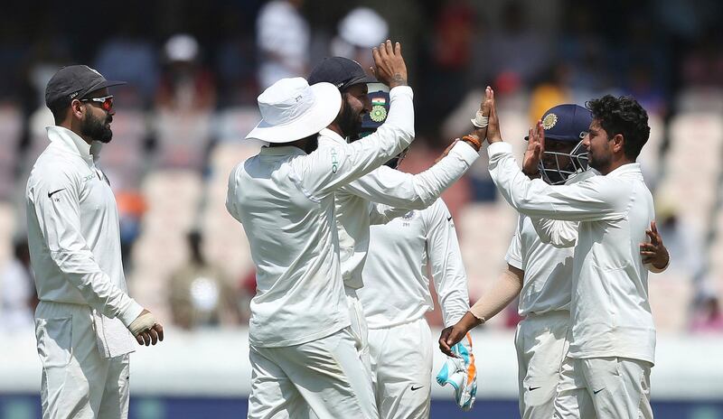 Indian bowler Kuldeep Yadav celebrates the dismissal of West Indies' Sunil Ambris during the first day of the second cricket test match between India and West Indies in Hyderabad, India.