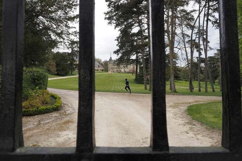 French half marathon runner Yosi Goasdoue trains at the Chateau de la Bourdaisiere, where he is staying during the lockdown. AFP