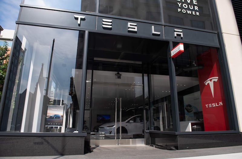 A Tesla showroom is seen in Washington, DC, on August 8, 2018. - Tesla's board of directors said Wednesday it will evaluate chief executive Elon Musk's proposal to take the electric car maker private. After Musk last week raised the idea as a better solution for Tesla's long-term growth, directors met "several times" and are "taking the appropriate next steps to evaluate this," the board said in a brief statement issued before the stock market opened. (Photo by SAUL LOEB / AFP)