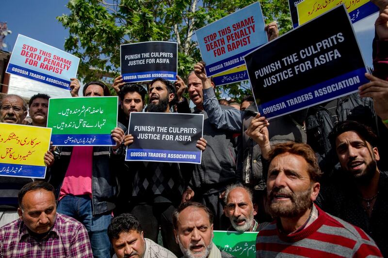 Kashmiri traders and local residents shout slogan during a protest against the rape and murder of 8-year-old Asifa, in Srinagar, Indian-controlled Kashmir, on April 13, 2018. Dar Yasin / AP Photo