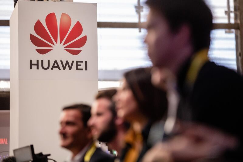 The Huawei Technologies Co. logo sits on the company's exhibition stand at the Viva Technology conference in Paris, France, on Thursday, May 16, 2019. Donald Trump's latest offensive against China's Huawei puts Europe in an even bigger bind over which side to pick, but France's President Emmanuel Macron is holding the line. Photographer: Marlene Awaad/Bloomberg