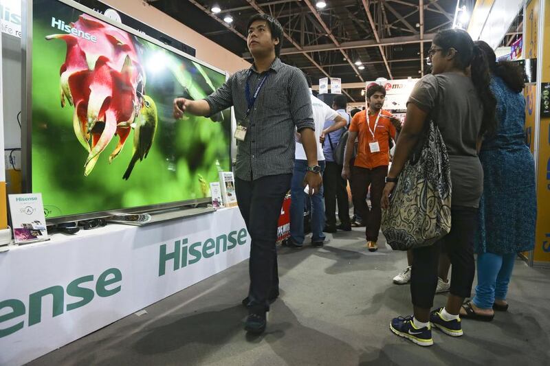 The  84-inch Hisense, ultra-high resolution television that comes with its own stand, and a 2014 model Beemer. The deal, by Sharaf DG, is one of the many bargains up for grabs at Gitex Shopping 2013 at the World Trade Centre’s Exhibition Halls. Lee Hoagland / The National  
