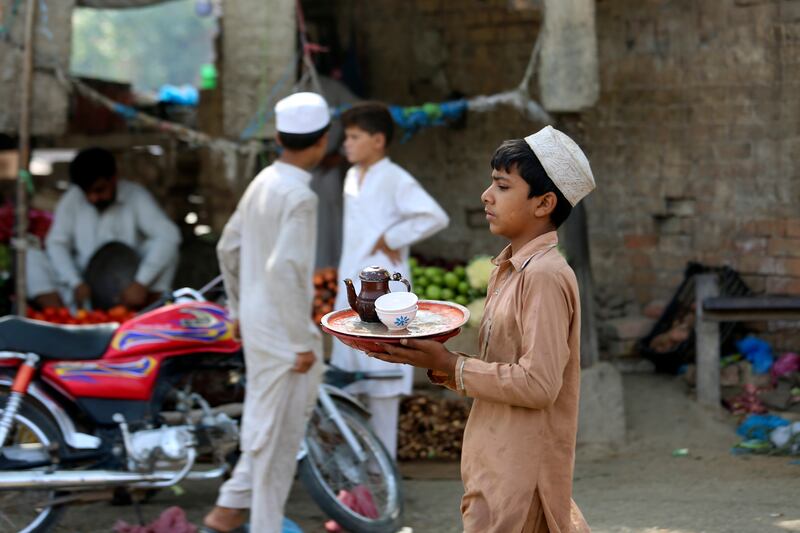 A Pakistani boy works at a tea shop in Peshawar. AP Photo