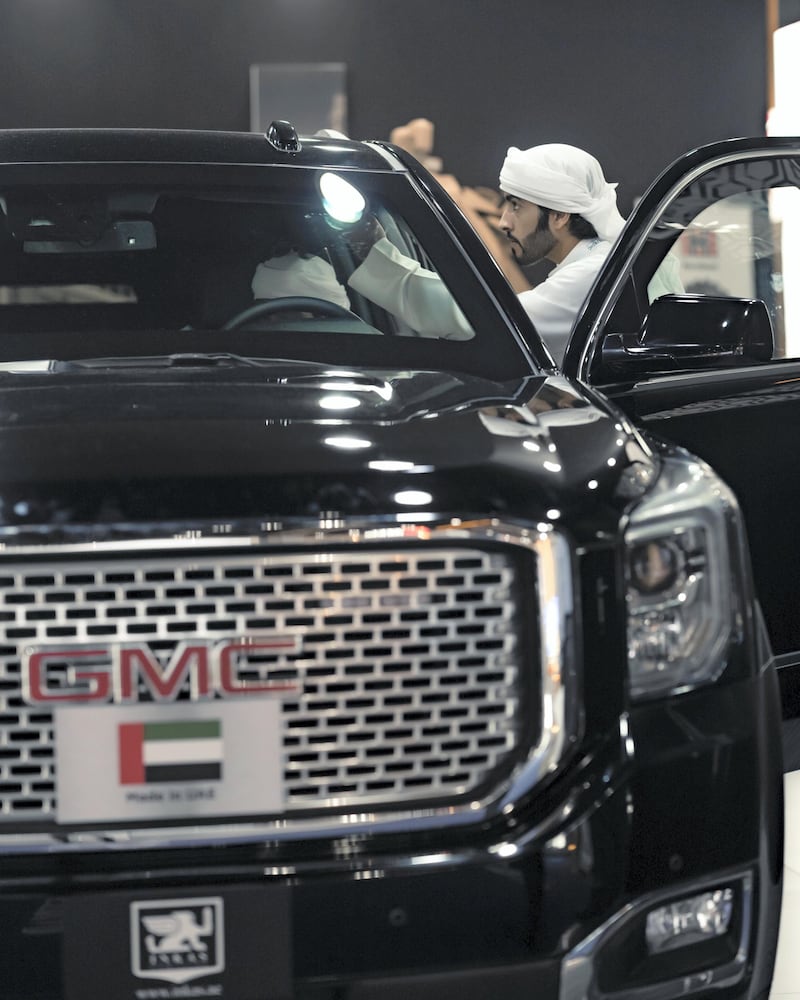 A visitor looks over one of Inka's customised GMCs. Olga Voronova / Inkas