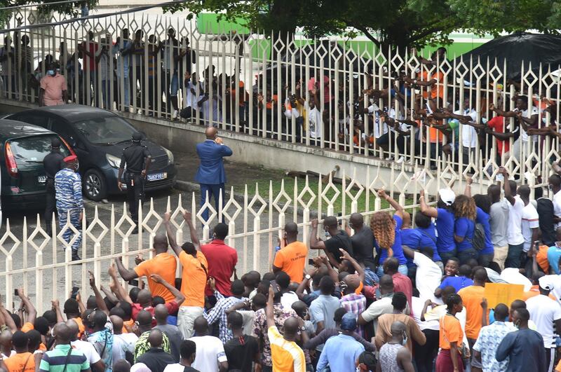 Didier Drogba (C) greets supporters. AFP