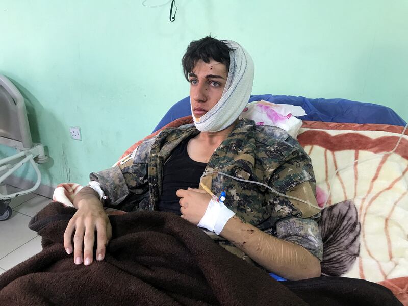 A man injured by Iranian attacks on the Iraqi city of Koye receives hospital treatment. Reuters