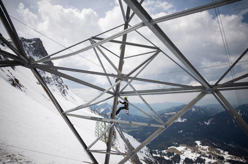 epaselect epa07578803 Repair work on a mast of the Saentis funicular at the Schwaegalp in Hundwil, Switzerland, 17 May 2019. The funicular and the restaurant were hit by two avalanches in January 2019.  EPA/GIAN EHRENZELLER