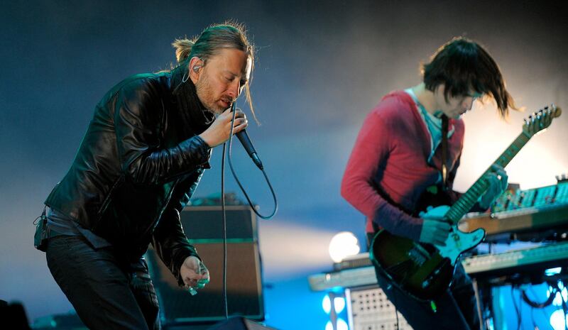 FILE - In this April 14, 2012 file photo, Thom Yorke, left, and Jonny Greenwood of Radiohead perform during the band's headlining set at the 2012 Coachella Valley Music and Arts Festival in Indio, Calif.  Radiohead says a trove of unreleased music has been stolen and is being used for ransom, but instead of paying up, the band announced Tuesday June 11, 2019, they will release it in aid of environmental activist group Extinction Rebellion.(AP Photo/Chris Pizzello, File)