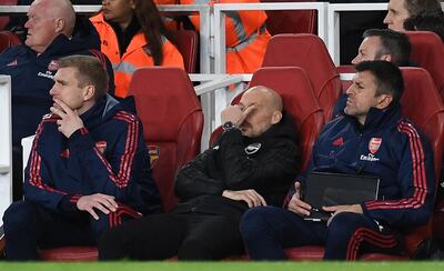epa08047732 Arsenal caretaker manager Freddie Ljungberg (C) and assistant coaches Per Mertesacker (L) and Sal Bibbo (R) watches his team loose 2-1 to Brighton during an English Premier League soccer match in London, Britain, 05 December 2019.  EPA/ANDY RAIN EDITORIAL USE ONLY. No use with unauthorized audio, video, data, fixture lists, club/league logos or 'live' services. Online in-match use limited to 120 images, no video emulation. No use in betting, games or single club/league/player publications
