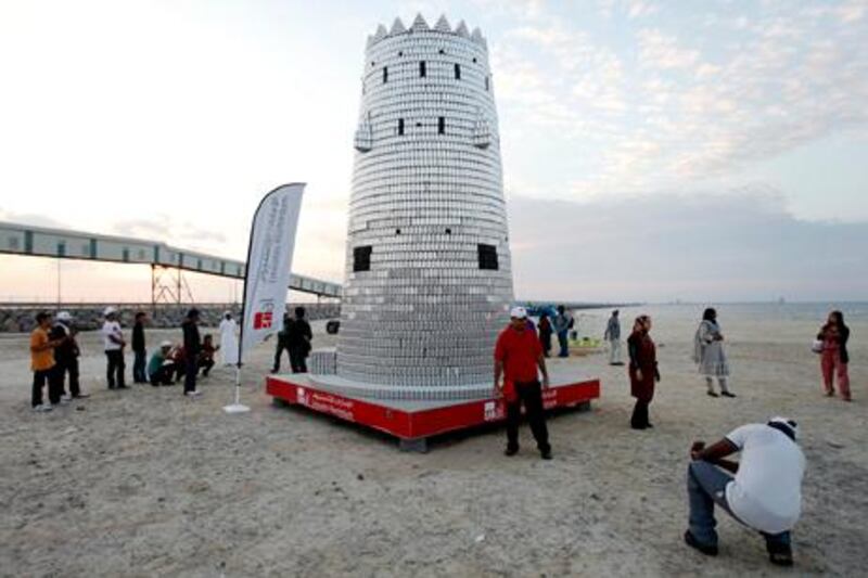 Abu Dhabi, December 8, 2012 --  Emirates Aluminum broke the world record for a structure made of the most aluminum cans after a team of thirty eight created a replica Maqta Fort at the beach in Taweela in Abu Dhabi, December 8, 2012. (Photo by: Sarah Dea/The National)