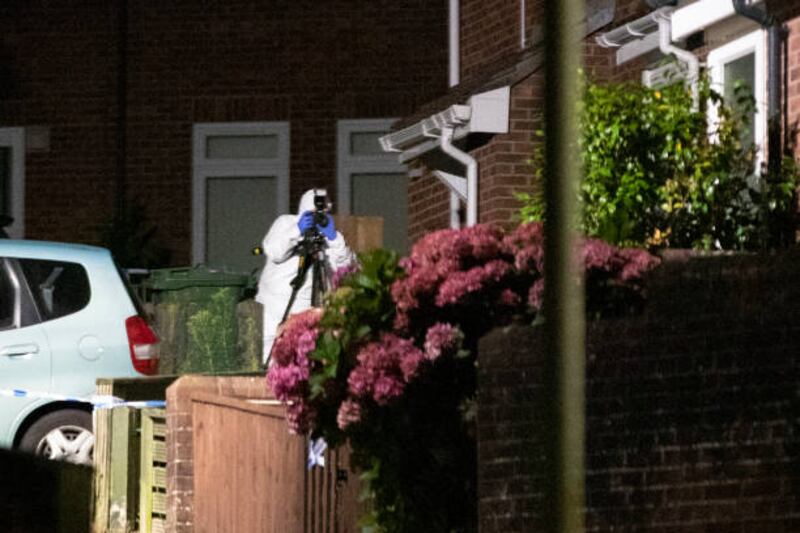 Police gather evidence in Plymouth. The gunman shot dead two men, two women and a young child, before killing himself.