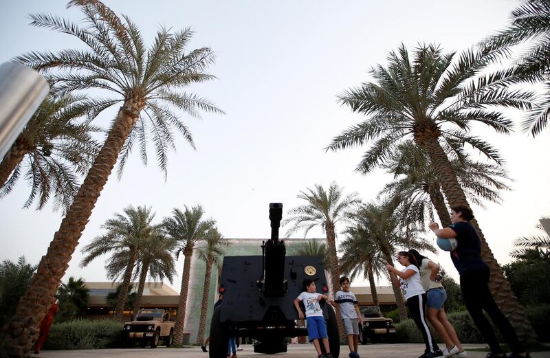 epa07551624 People gather close to a Ramadan cannon, a symbolic tool that was used during the old days to announce Iftar (Breakfast) time, at Umm Al Emarat Park, Abu Dhabi, United Arab Emirates, 06 May 2019. Muslims around the world celebrate the holy month of Ramadan by praying during the night time and abstaining from eating, drinking, and sexual acts during the period between sunrise and sunset. Ramadan is the ninth month in the Islamic calendar and it is believed that the revelation of the first verse in Koran was during its last 10 nights.  EPA/ALI HAIDER