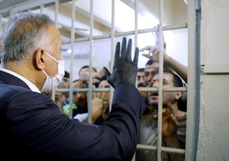 Iraqi Prime Minister Mustafa Al Kadhimi talks to prisoners during his visit in the central investigation prison in Al Muthana airport in Baghdad, Iraq. Reuters