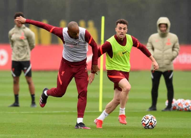 Liverpool's Diogo Jota and Fabinho during training.