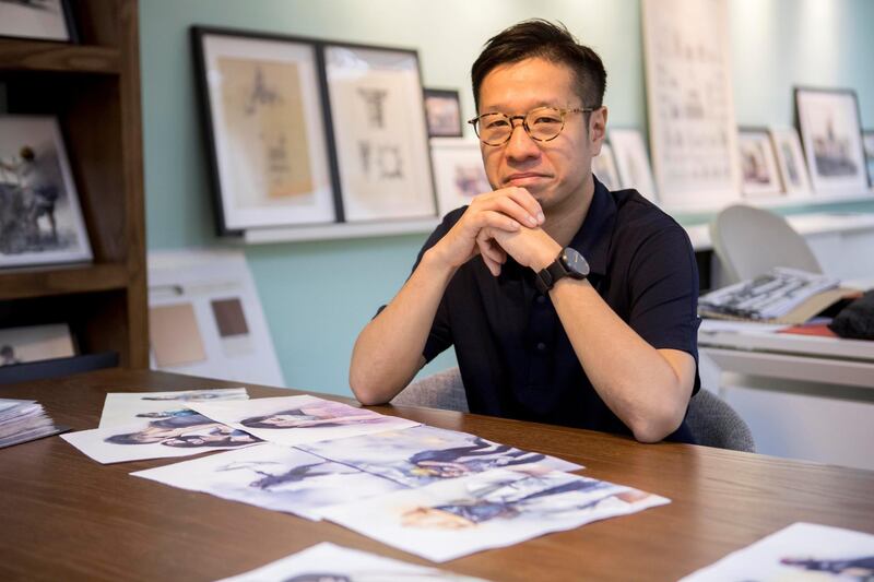HONG KONG: ART FEATURE:
Pictured: Artist Kin Fung poses for a portrait in his office and studio. Kin paints watercolours of famous moments of the demonstrations and plans to have an exhibition when the movement is finally over.
