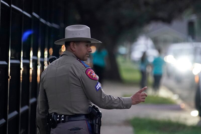 A Texas state trooper stands watch as pupils are dropped off at Uvalde Elementary for the first day of school. AP
