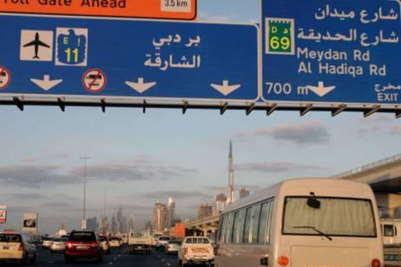 **APN ADVANCE FOR SUNDAY FEB. 15**  Cars move on Sheikh Zayed highway with the world's tallest tower, Burj Dubai in the background in Dubai, United Arab Emirates, Tuesday, Jan. 6, 2009. (AP Photo/Kamran Jebreili) *** Local Caption ***  NY335_APN_Driving__Dubai_.jpg