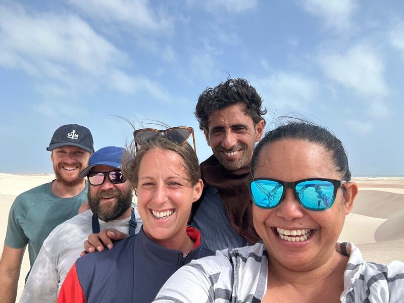 The four sailors were trying to sail from Kenya to the UAE. From left, Euan Jarvis, Jethro Friggens, Caroline Kneitz, one of the Yemeni rescuers and Dacey Calisura.