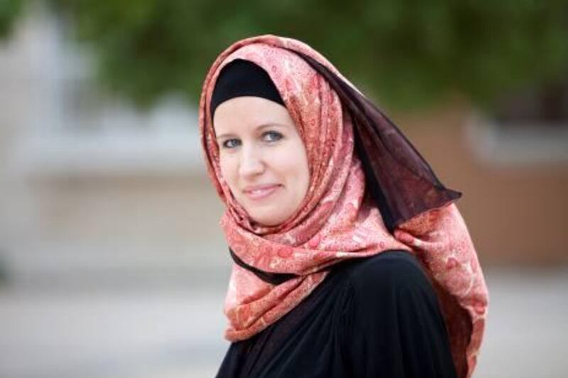 UAE - Dubai - Aug 23 - 2011: Danielle Ashley, recently converted to Islam, pose for a portrait outside her building in Discovery Gardens. ( Jaime Puebla - The National Newspaper )