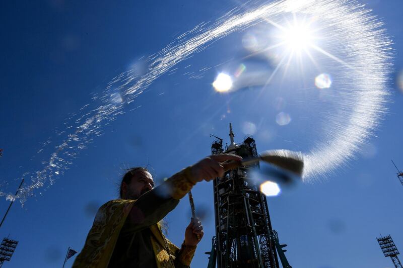 A Russian Orthodox priest blesses the Soyuz MS-13 spacecraft at the launch pad of the Baikonur cosmodrome. AFP
