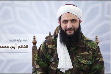 Abu Mohammad Al Jolani, the head of former Syria's former Al Qaeda affiliate Hayat Tahrir Al Sham, has appeared in a new video apparently filmed in Idlib. Al-Manara Al-Baydaa / AFP