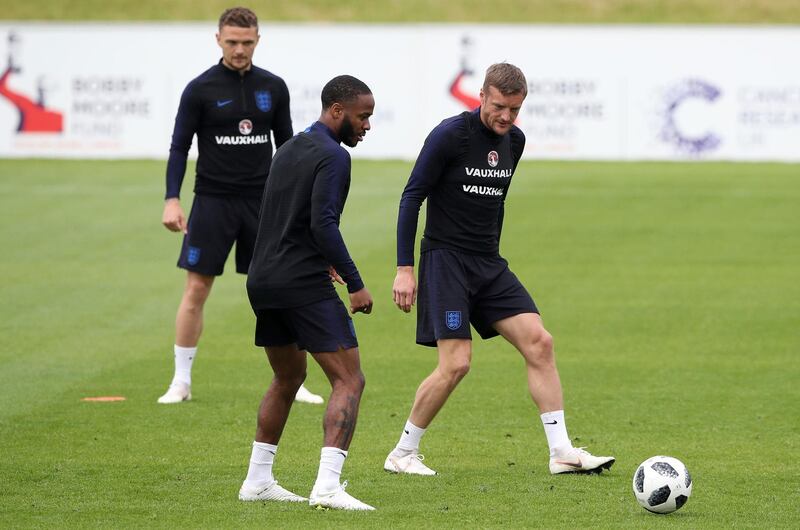 England's Raheem Sterling visibly showing a tattoo on his leg during a training session at St George's Park, Burton, England Monday May 28, 2018 as the England team prepares for the upcoming soccer World Cup. (Nick Potts/PA via AP)