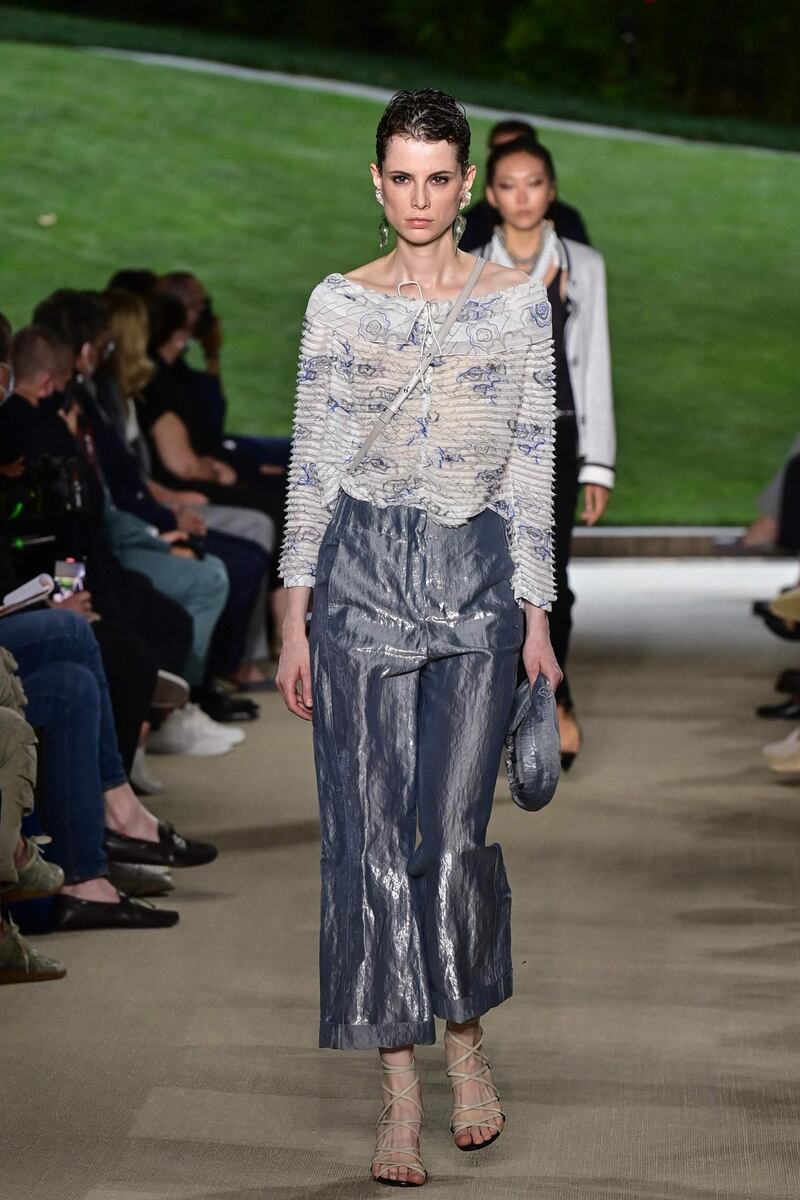 A model walks the runway during the Giorgio Armani show at Milan Men's Fashion Week on June 21, 2021 in Milan, Italy. AFP