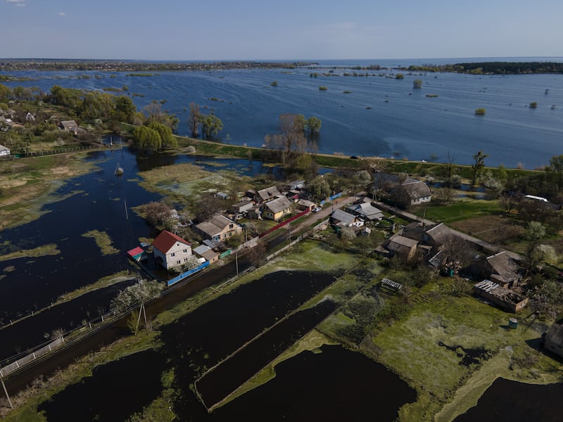 Flooded gardens and fields are shown in Demydiv, Ukraine. To keep Russian armoured columns at bay, Ukrainian forces released water from a nearby hydroelectric dam to intentionally flood Demydiv, a village north of Kyiv. The decision was effective, but efforts to drain the area are complicated. Getty Images