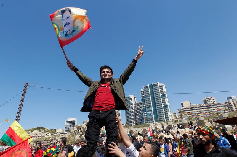 A Kurdish man gestures as he celebrates the Nowruz festival amid the spread of the coronavirus, in Beirut, Lebanon, on March 28, 2021. Reuters