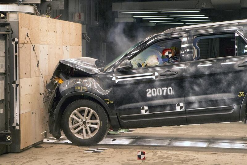 A 2014 Ford Explorer collides with a barrier at 30mph during a crash test demonstration at the Dearborn Development Center. Rena Laverty / EPA
