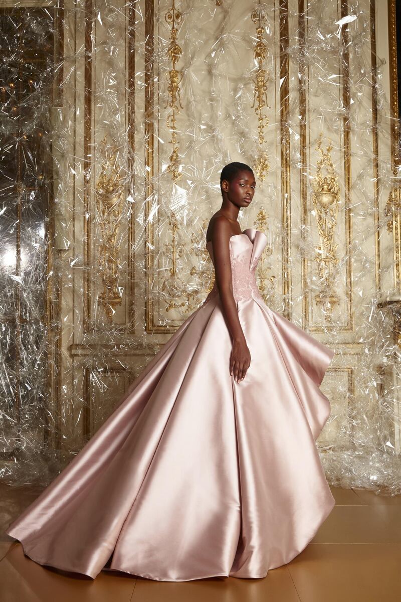 A full skirted gown in softly folded nude duchesse satin