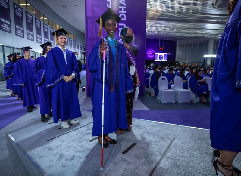 Graduates line up to receive their diplomas.