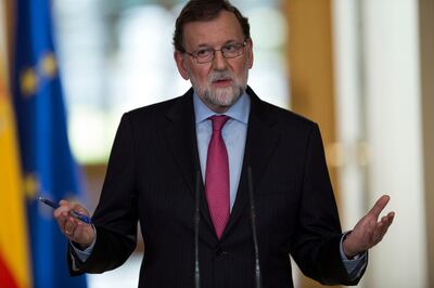 Spain's Prime Minister Mariano Rajoy gestures as he talks to journalists during a news conference following to the last Cabinet meeting of the year at the Moncloa palace in Madrid, Friday, Dec. 29, 2017. Rajoy said he intends calling the first session for the new parliament of Spain's restive region of Catalonia on Jan. 17. (AP Photo/Francisco Seco)