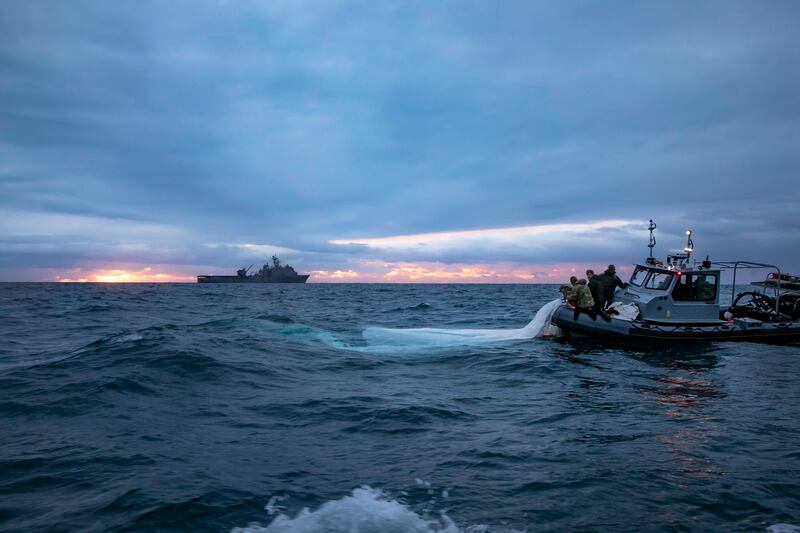 US sailors look for more debris. US Navy / EPA