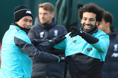 Liverpool's Mohamed Salah, right, with Takumi Minamino during a training session at Melwood. AFP