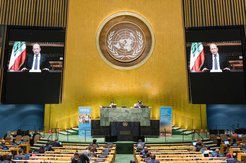 epa08687368 A handout photo made available by UN photo shows Michel Aoun, President of Lebanon, speaking during the 75th General Assembly of the United Nations, in New York, New York, USA, 21 September 2020. Due to the COVID-19 coronavirus pandemic, the 75th General Assembly of the United Nations meetings are held mostly virutal. Seated at dais are Volkan Bozkir (at left), President of the seventy-fifth session of the United Nations General Assembly, and Secretary-General Antonio Guterres.  EPA/Rick Bajornas / UN Photo / HANDOUT  HANDOUT EDITORIAL USE ONLY/NO SALES