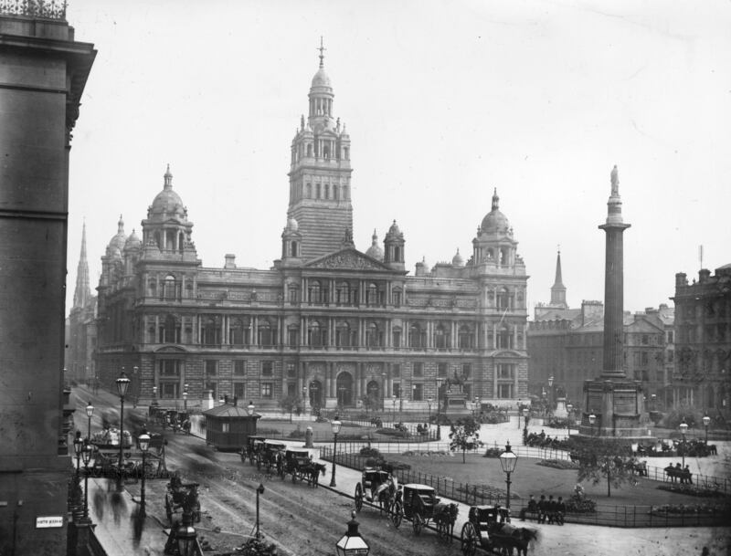 The Municipal Buildings in George Square, central Glasgow, in 1900. Glasgow's City Chambers are built in Italian Renaissance style and were opened by Queen Victoria in 1888. Getty Images